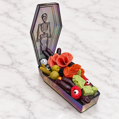 Single-serving Halloween coffin charcuterie on white marble